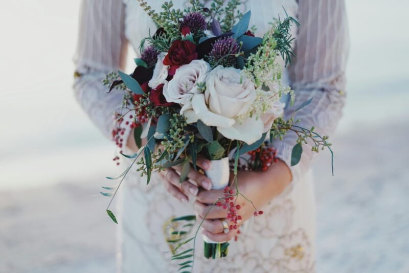 women holding bouquet